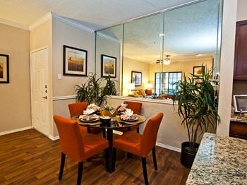 The courts at preston oaks apartment homes separate dining area with mirrored wall